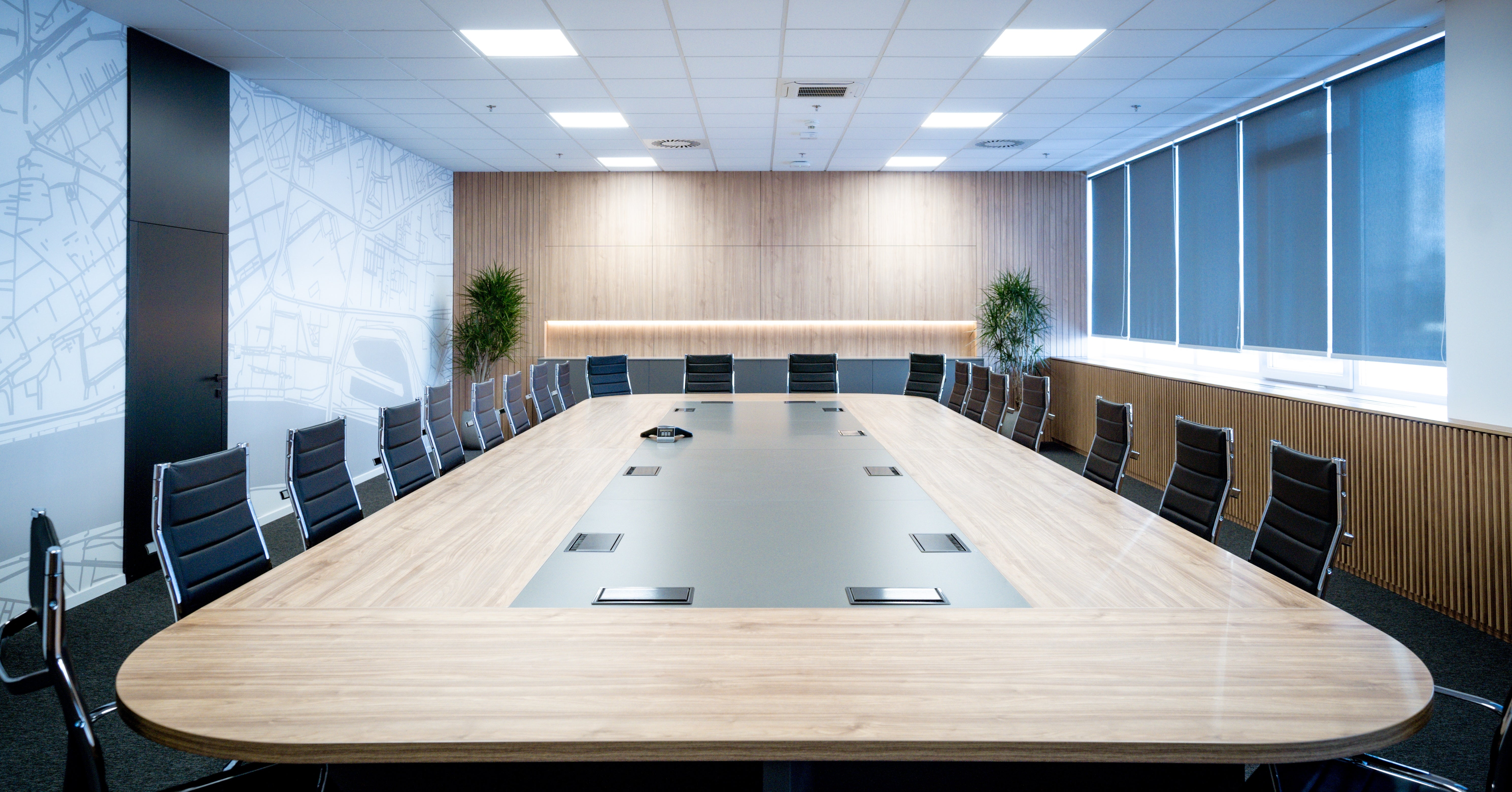 Large modern conference or board room with many chairs surrounding a table